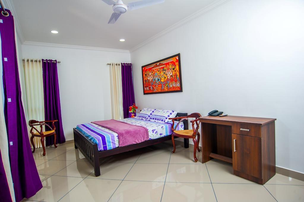 تريفِندرم Vasudevam Premium Suites الغرفة الصورة